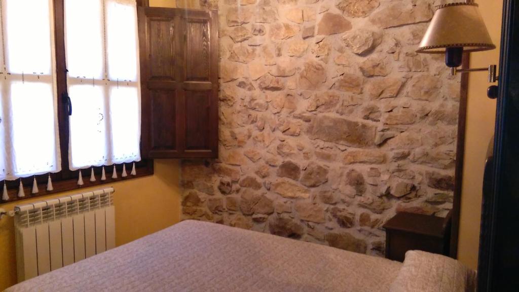A bed or beds in a room at Casa de Aldea El Torrexon