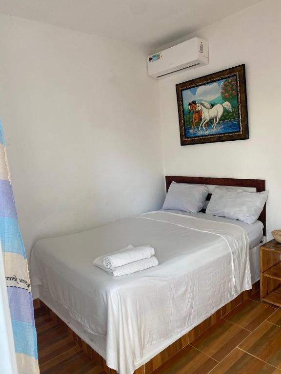Postel nebo postele na pokoji v ubytování Hotel El Encanto