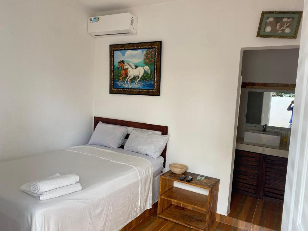 Postel nebo postele na pokoji v ubytování Hotel El Encanto