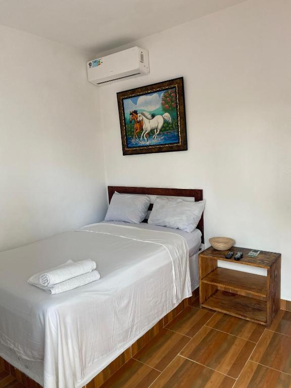 Postel nebo postele na pokoji v ubytování Hotel El Encanto