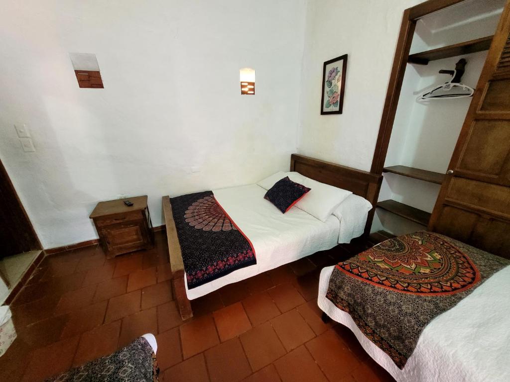 Postel nebo postele na pokoji v ubytování posada doña Flor María