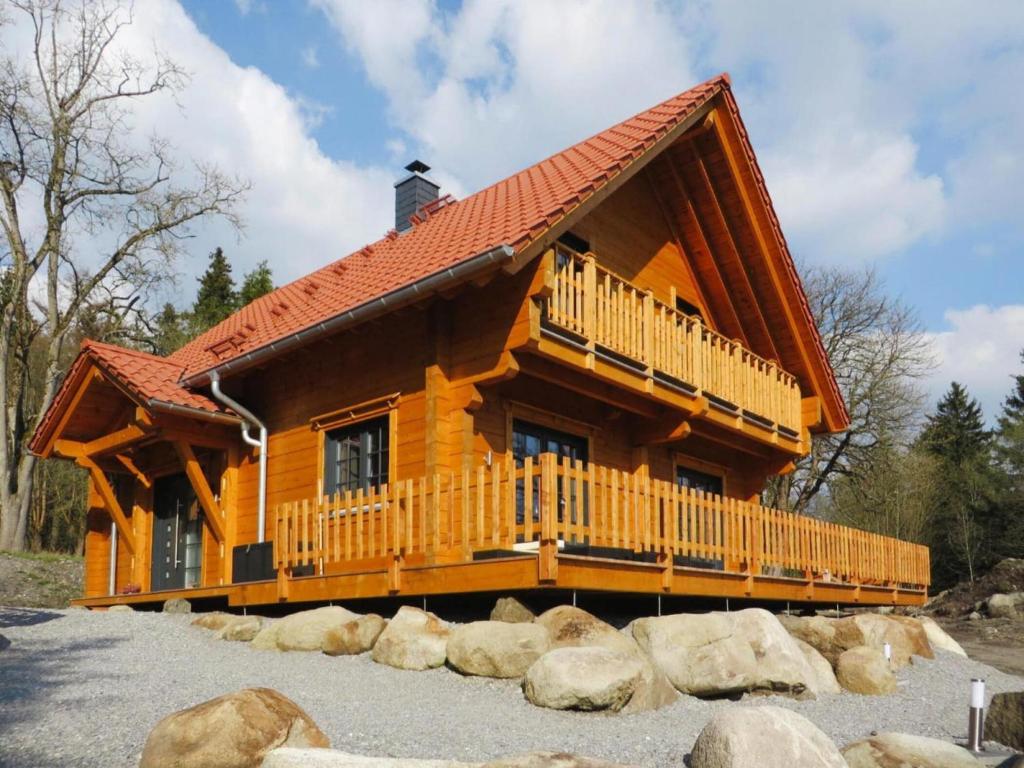 a large log cabin with a large deck at Ferienhaus, Schierke in Schierke