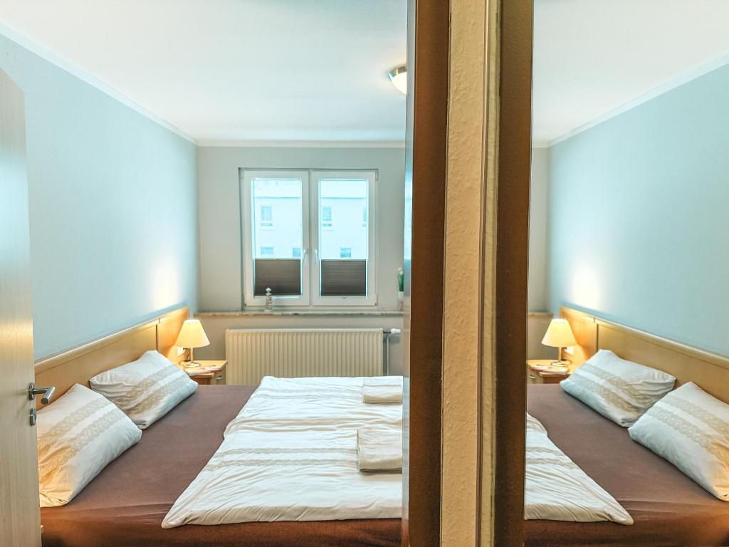 Postel nebo postele na pokoji v ubytování Haus Leuchtfeuer