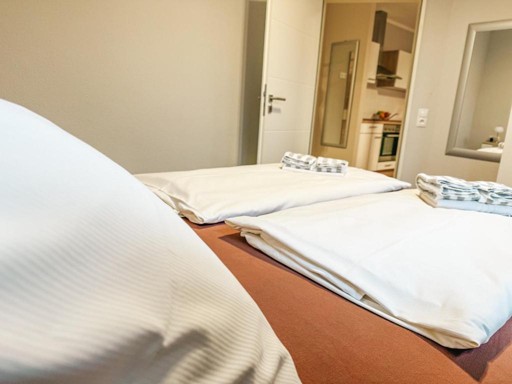 Postel nebo postele na pokoji v ubytování Haus Leuchtfeuer