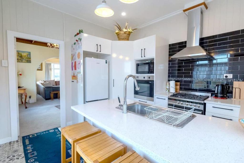 a kitchen with a sink and a counter top at Central Villa in Rotorua