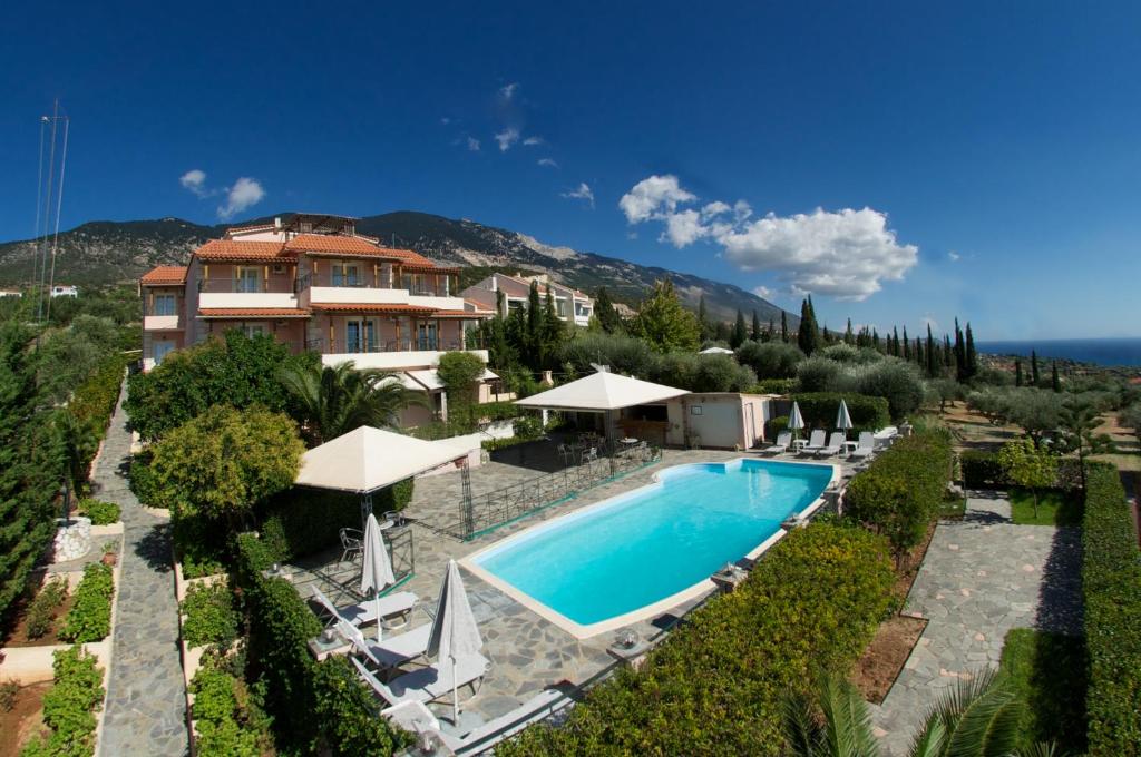 an image of a villa with a swimming pool at Nostos in Mousata