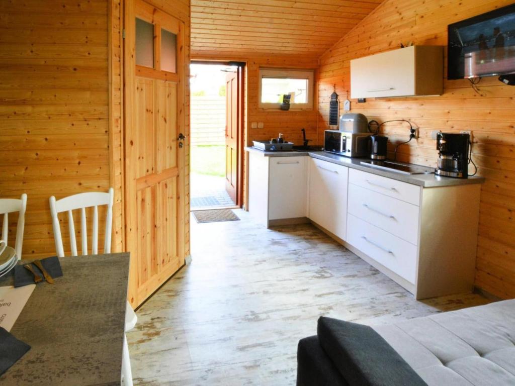 Kuchyňa alebo kuchynka v ubytovaní Year-round cottage, Ustronie Morskie