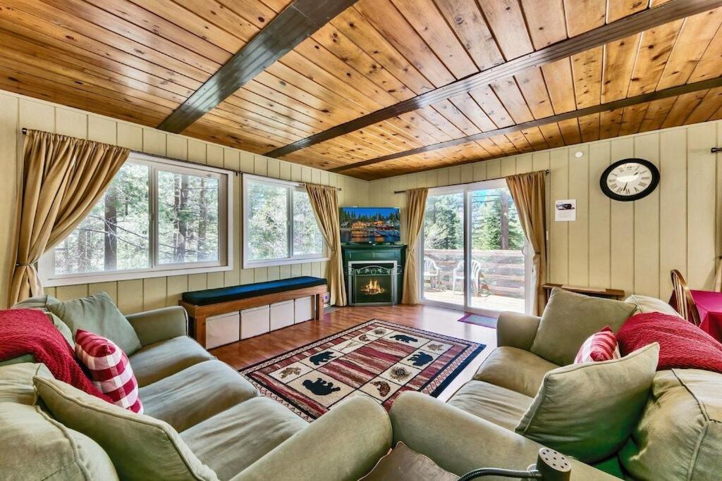 a living room with a couch and a table at Bear Haus - Sledding At Cabin - Forest Views - Foosball in South Lake Tahoe