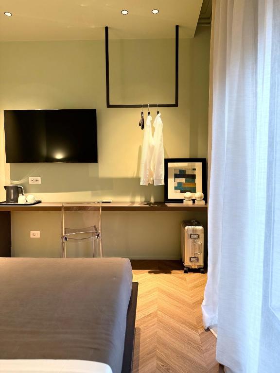 TV a/nebo společenská místnost v ubytování Four Rooms Catania