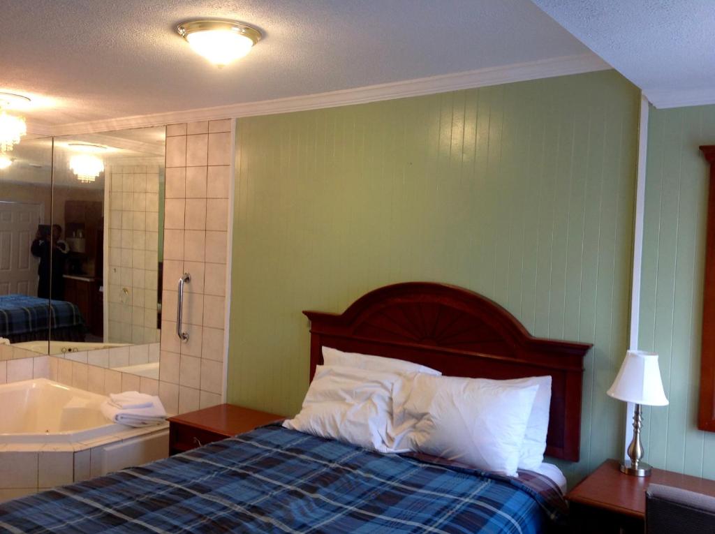 Postel nebo postele na pokoji v ubytování Relax Inn