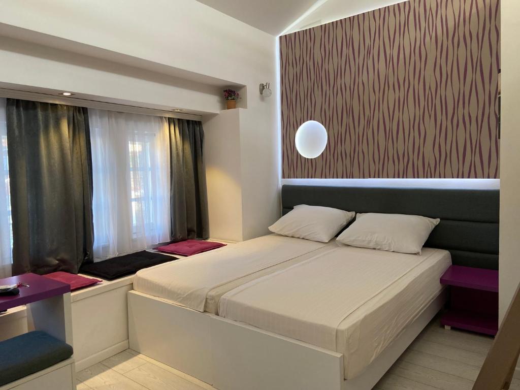 Postel nebo postele na pokoji v ubytování Guesthouse Biser