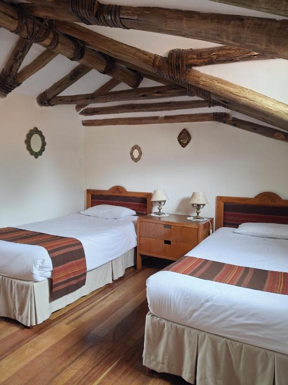 Postel nebo postele na pokoji v ubytování Casona La Recoleta