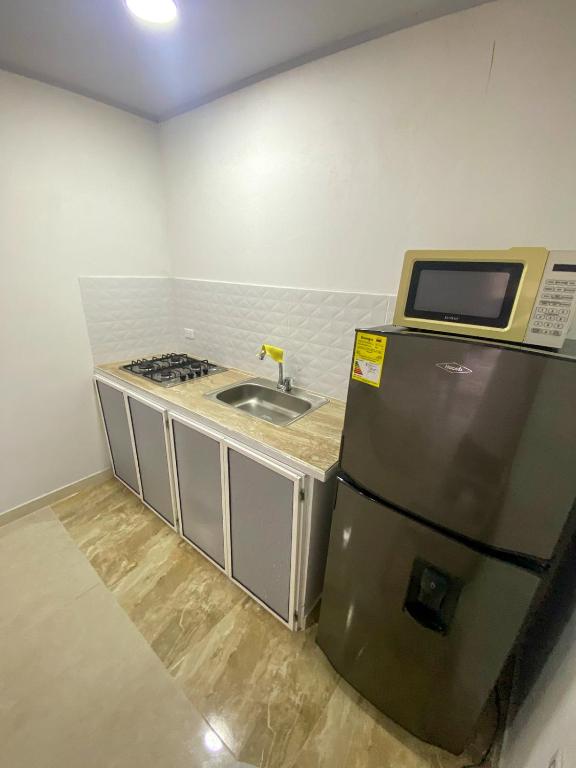 Kuchyň nebo kuchyňský kout v ubytování Posada Three Cay Suites