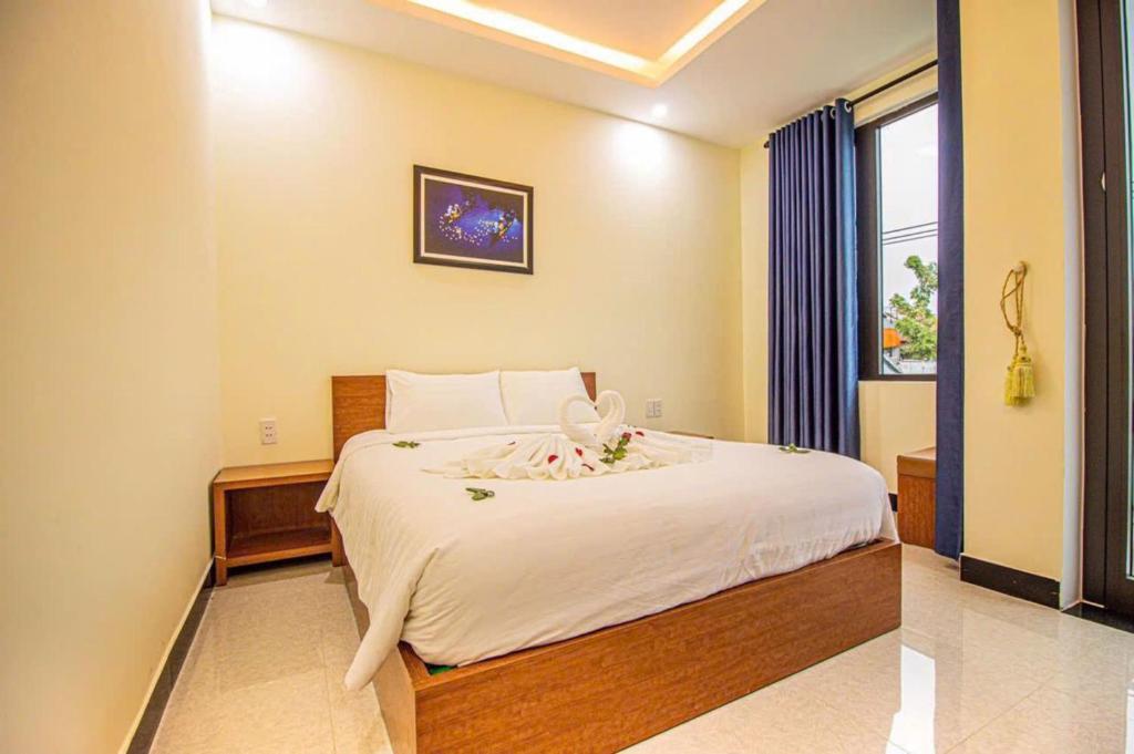 Giường trong phòng chung tại Gold Stone Hoi An Homestay