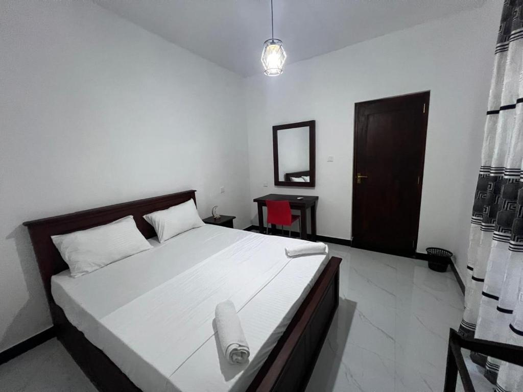 Postel nebo postele na pokoji v ubytování Golden Paradise Transit Hotel
