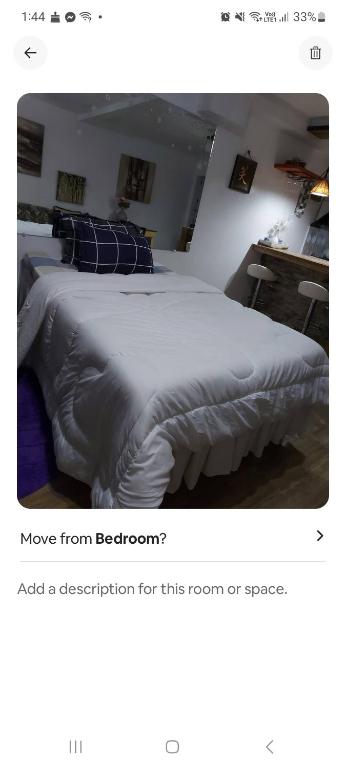 Llit o llits en una habitació de Studio room transient neo Calapan