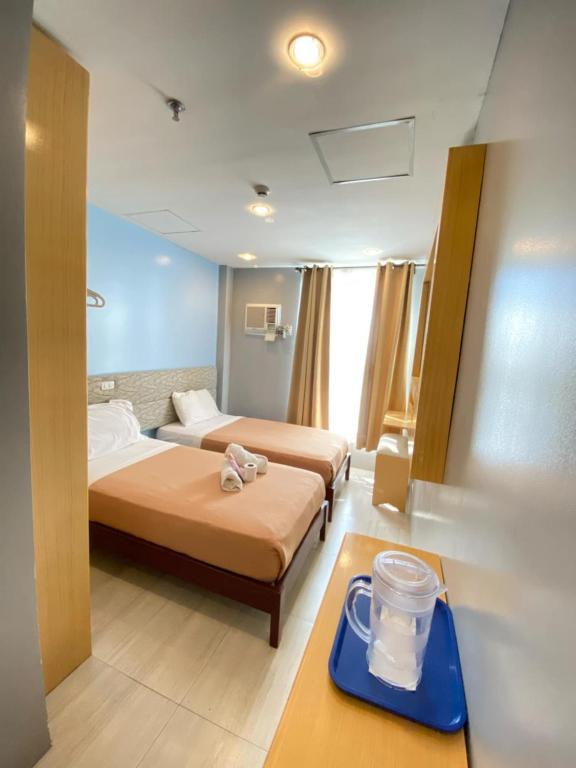 Postel nebo postele na pokoji v ubytování D' Loft Iligan