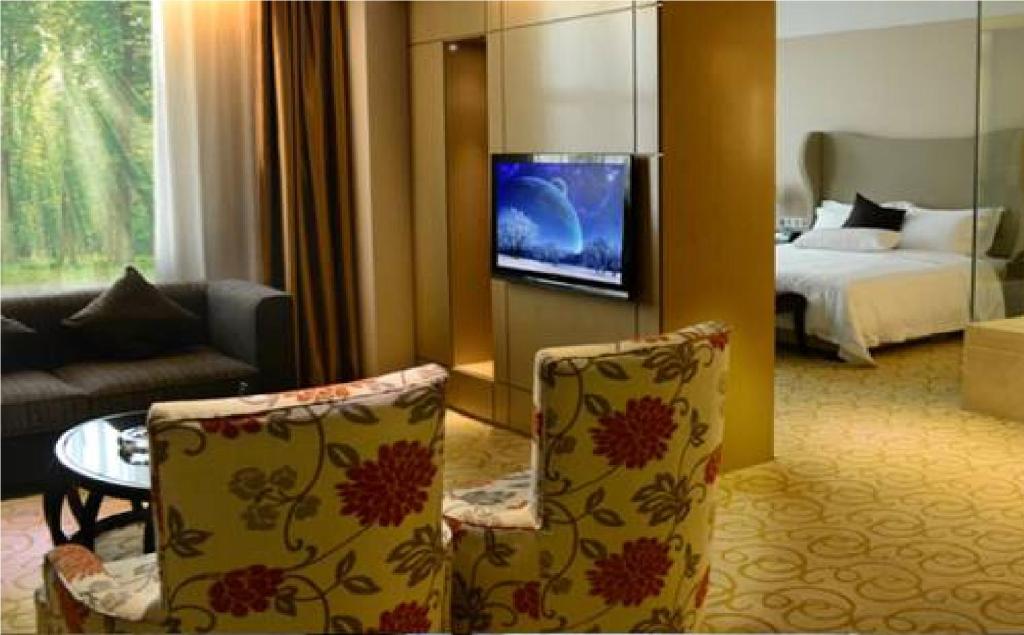 TV a/nebo společenská místnost v ubytování Shenzhen Shuidu Holiday Hotel, North Railway Station