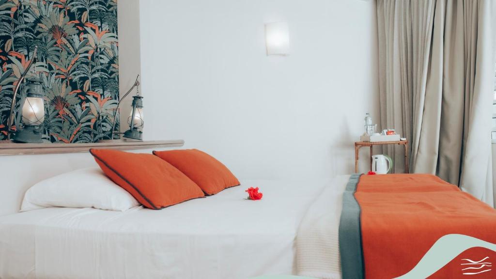 Postel nebo postele na pokoji v ubytování Andrea Lodges