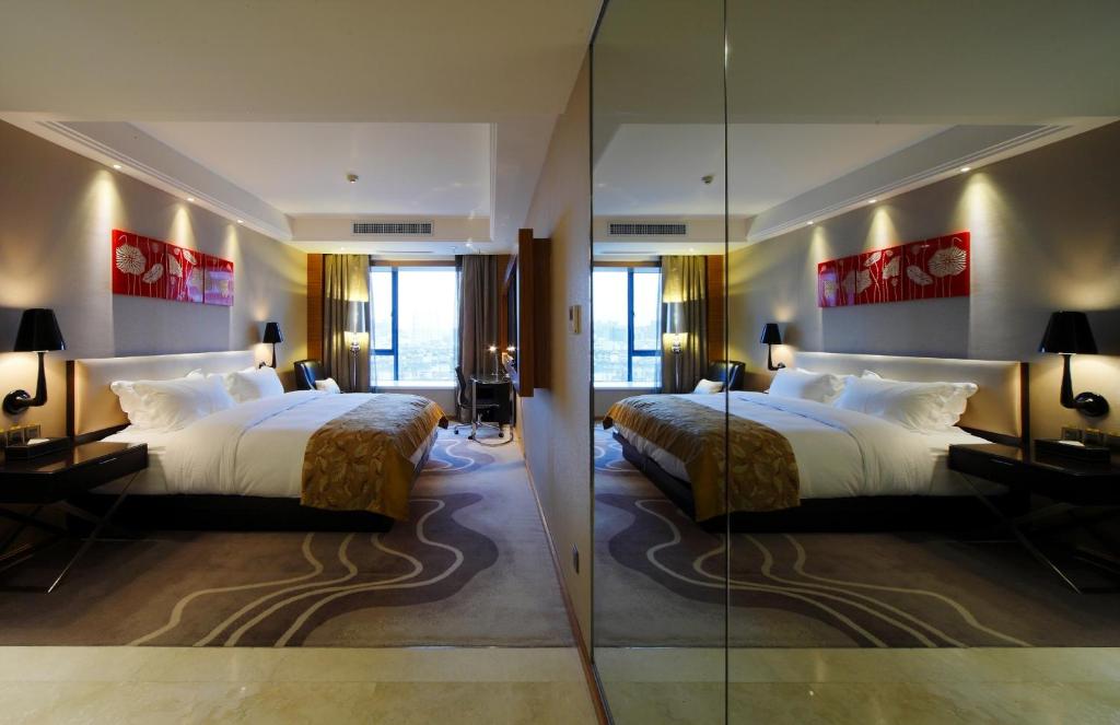 Postel nebo postele na pokoji v ubytování DW Hotel
