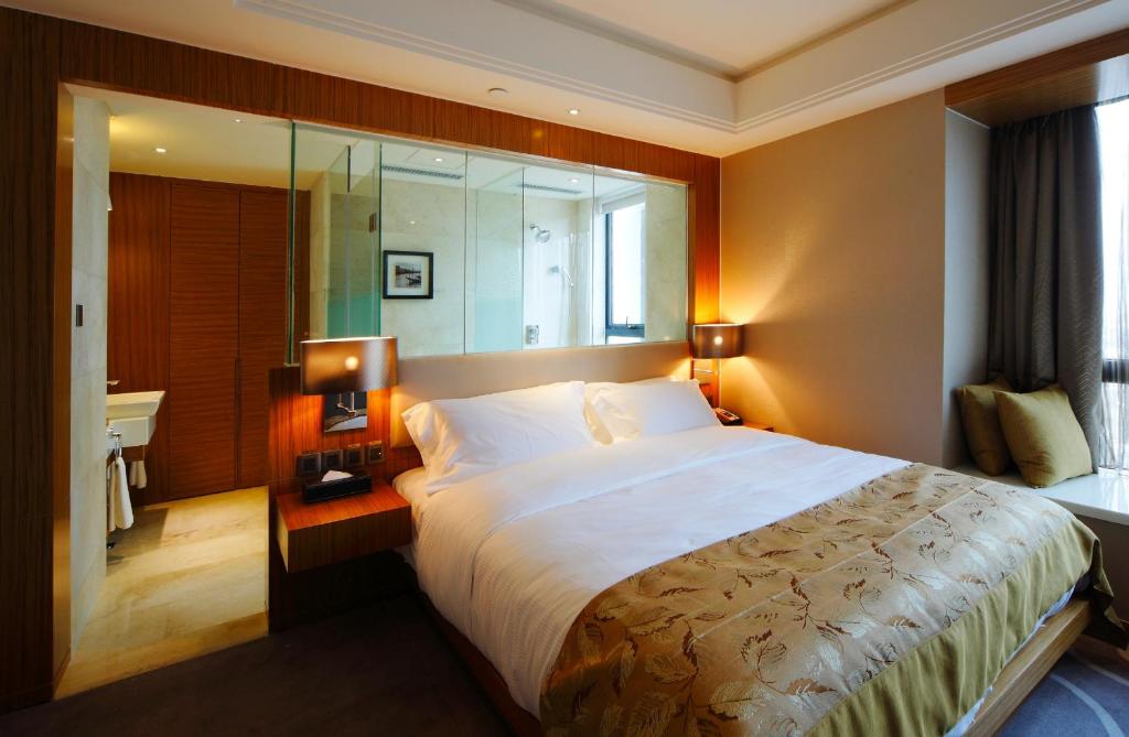 Postel nebo postele na pokoji v ubytování DW Hotel