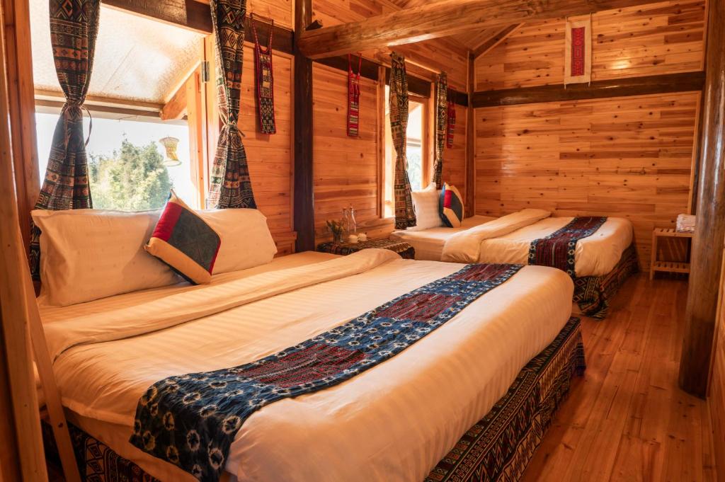 Postel nebo postele na pokoji v ubytování Hmong Farmstay
