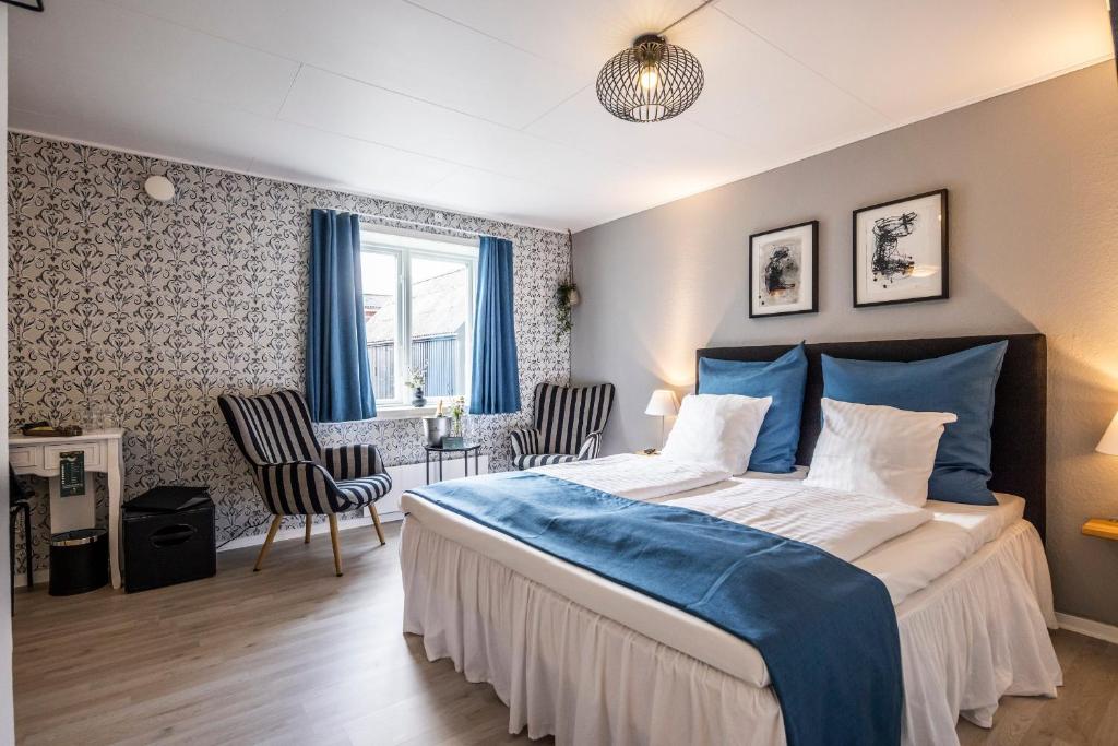 Postel nebo postele na pokoji v ubytování Marsk Hotellet