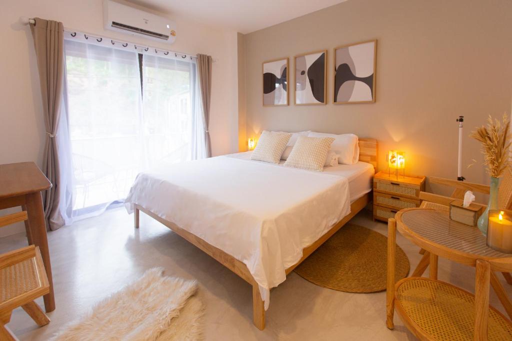 Postel nebo postele na pokoji v ubytování Place Hotel