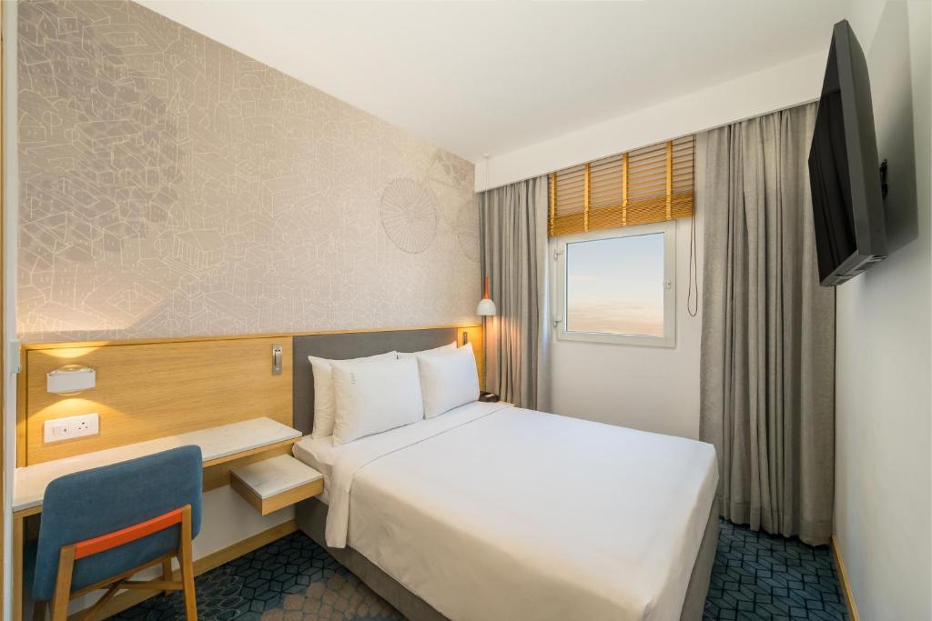 Postel nebo postele na pokoji v ubytování Holiday Inn Express Greater Noida Knowledge Park by IHG