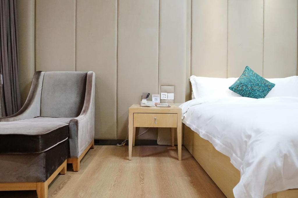 Postel nebo postele na pokoji v ubytování Paco Hotel Ouzhuang Metro Guangzhou-Free shuttle to Canton fair
