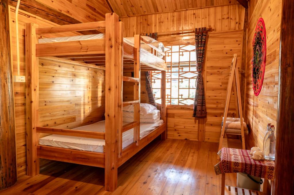 Postel nebo postele na pokoji v ubytování Hmong Farmstay