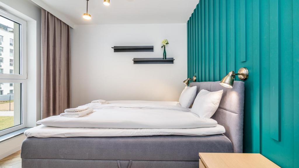 Posteľ alebo postele v izbe v ubytovaní CITYSTAY Św.Barbary Apartment