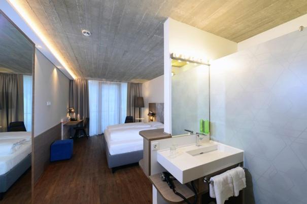 Postel nebo postele na pokoji v ubytování arte Hotel Kufstein