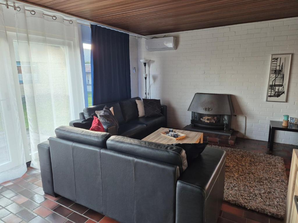 Posezení v ubytování Ferienhaus mit Meerblick