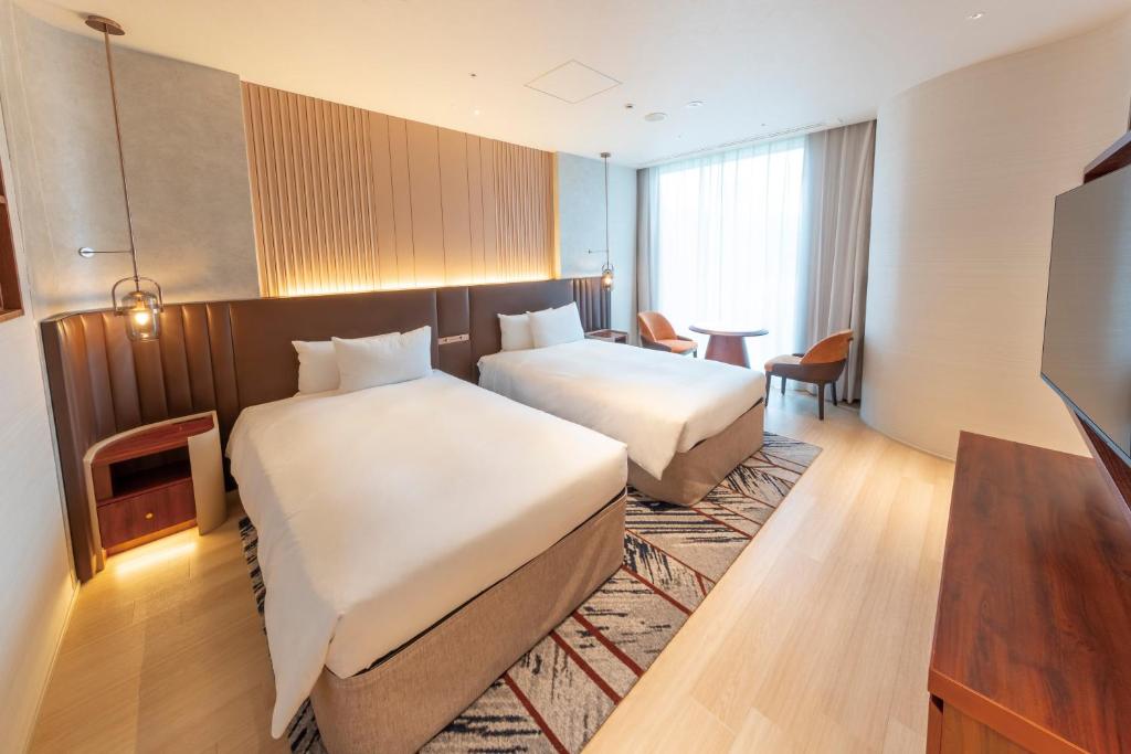 Postel nebo postele na pokoji v ubytování Hotel Springs Makuhari Premier