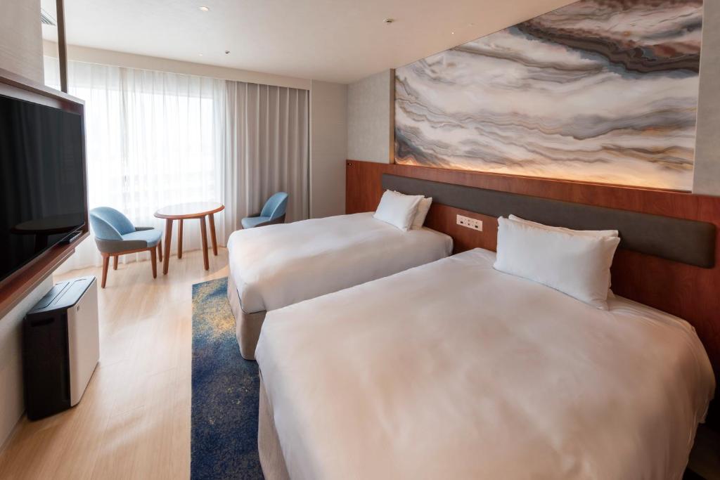 Postel nebo postele na pokoji v ubytování Hotel Springs Makuhari Premier
