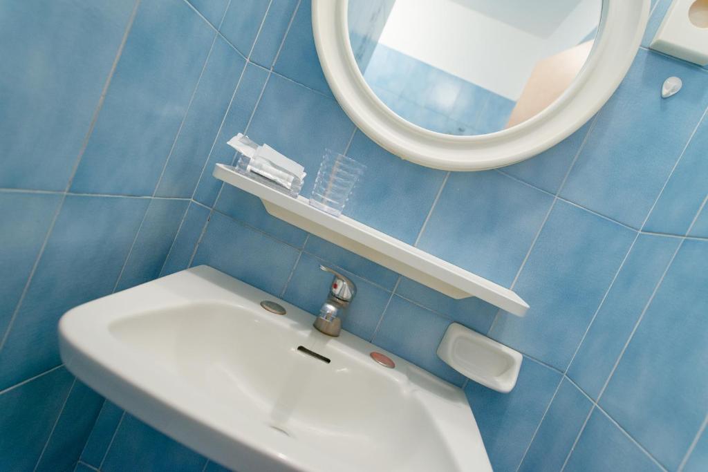 Koupelna v ubytování Hotel Falco