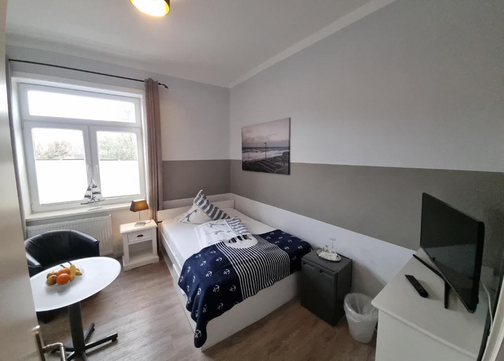 TV a/nebo společenská místnost v ubytování Hotel-Cafe-Lindow