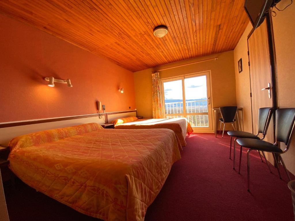Postel nebo postele na pokoji v ubytování Relais du Belloch