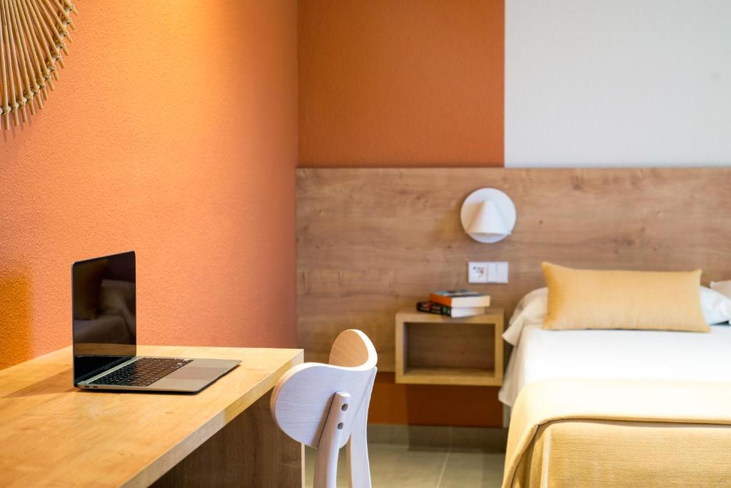 Postel nebo postele na pokoji v ubytování Hostal Barris