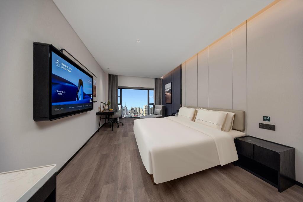 Ένα ή περισσότερα κρεβάτια σε δωμάτιο στο Atour Hotel Chengdu Jinniu Wanda North Railway Station