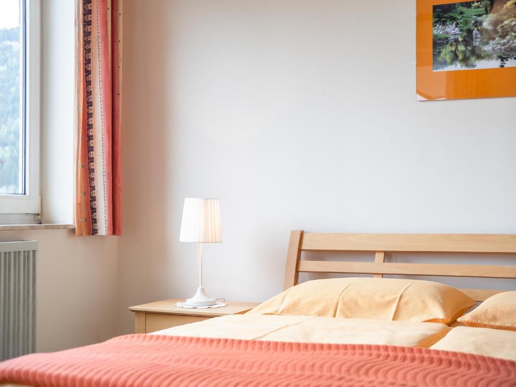 Posteľ alebo postele v izbe v ubytovaní Cozy Apartment in Afritz am See near Gerlitzen Ski Area
