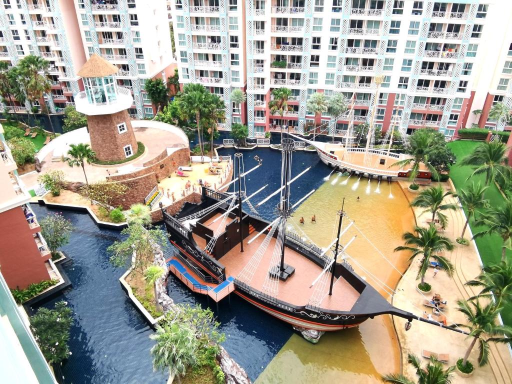 a large boat in a river in a city at Caribbean Water Park Hotel in Pattaya South