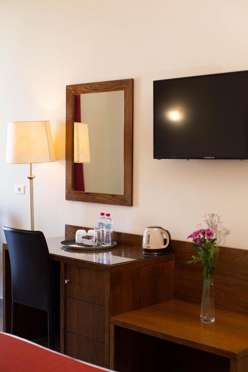 TV a/nebo společenská místnost v ubytování Cosmopolitan Hotel