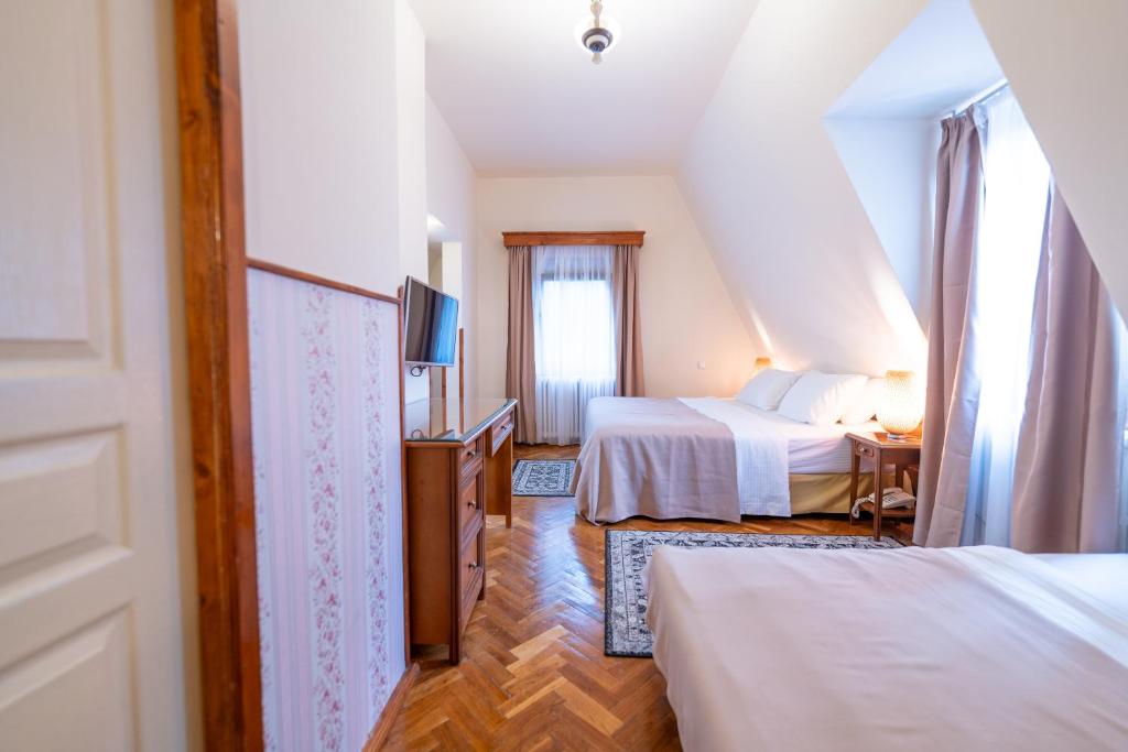 Postel nebo postele na pokoji v ubytování Vila Camelia