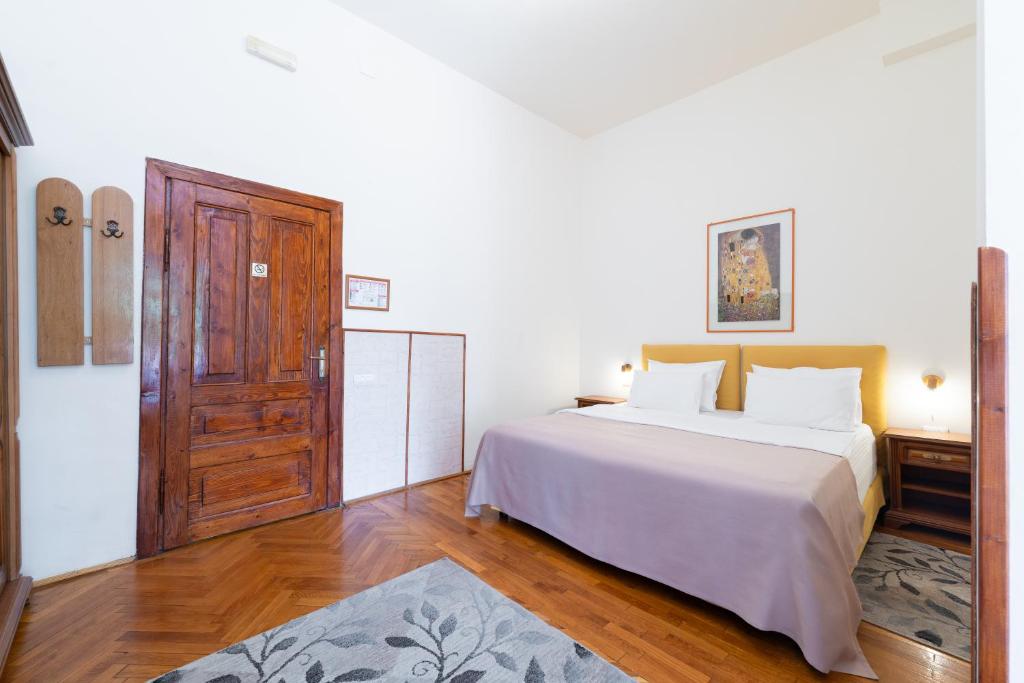 Postel nebo postele na pokoji v ubytování Vila Camelia