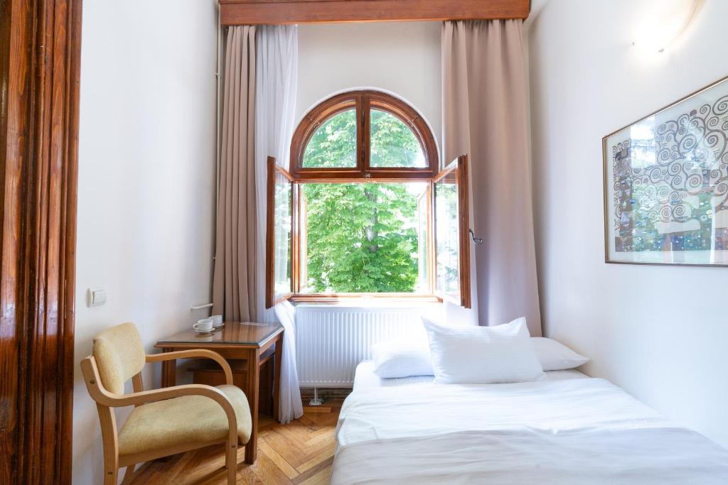 Postel nebo postele na pokoji v ubytování Vila Camelia
