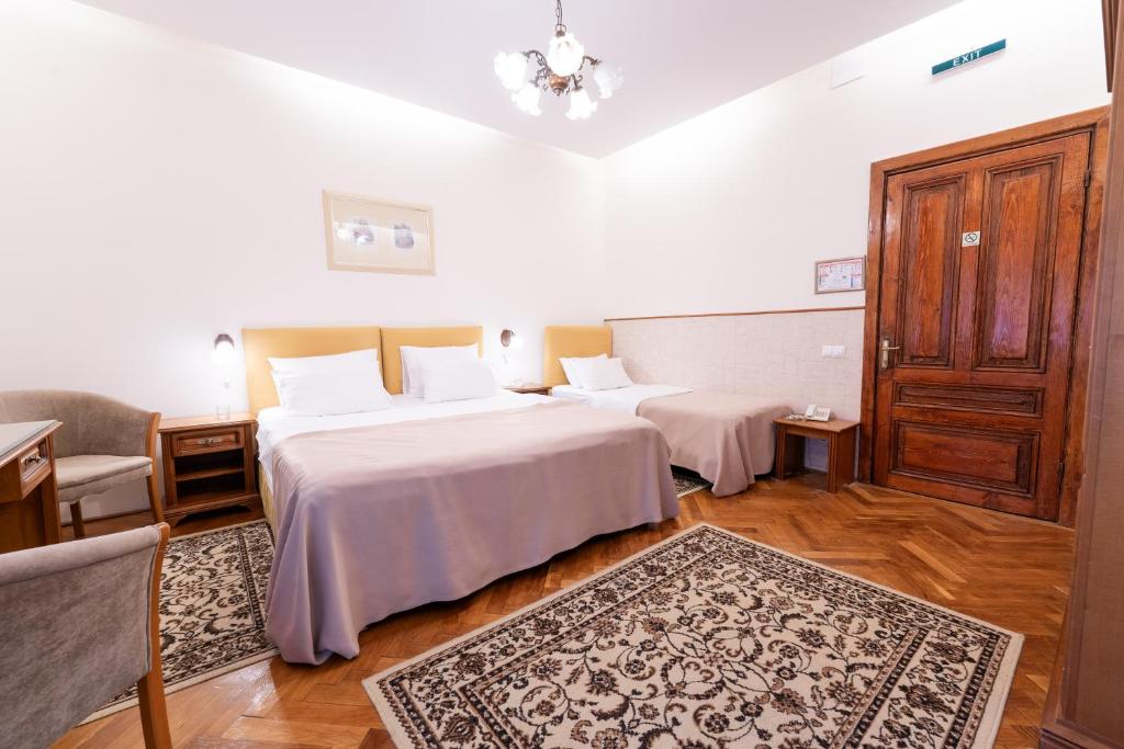 Postel nebo postele na pokoji v ubytování Vila Camelia