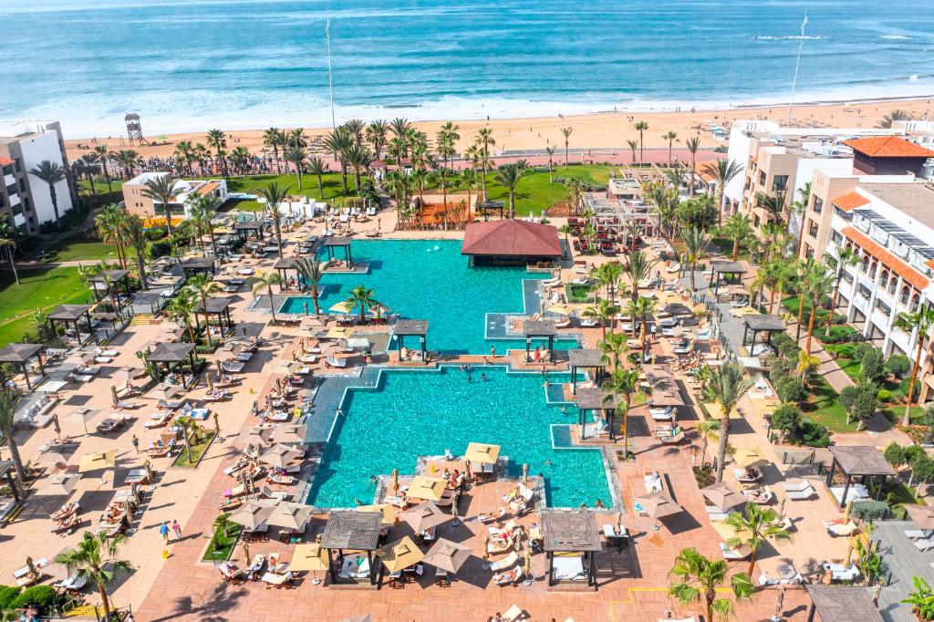 an aerial view of a resort with a pool and the beach at Hotel Riu Palace Tikida Agadir - All Inclusive in Agadir
