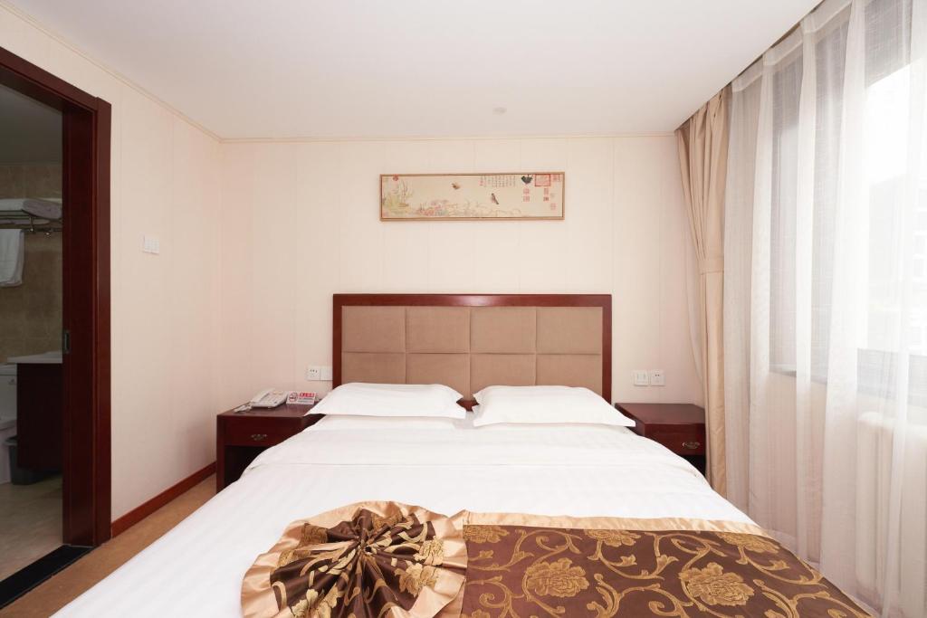 Postel nebo postele na pokoji v ubytování Yiju Hotel Beijing South Railway Station Muxiyuan Branch